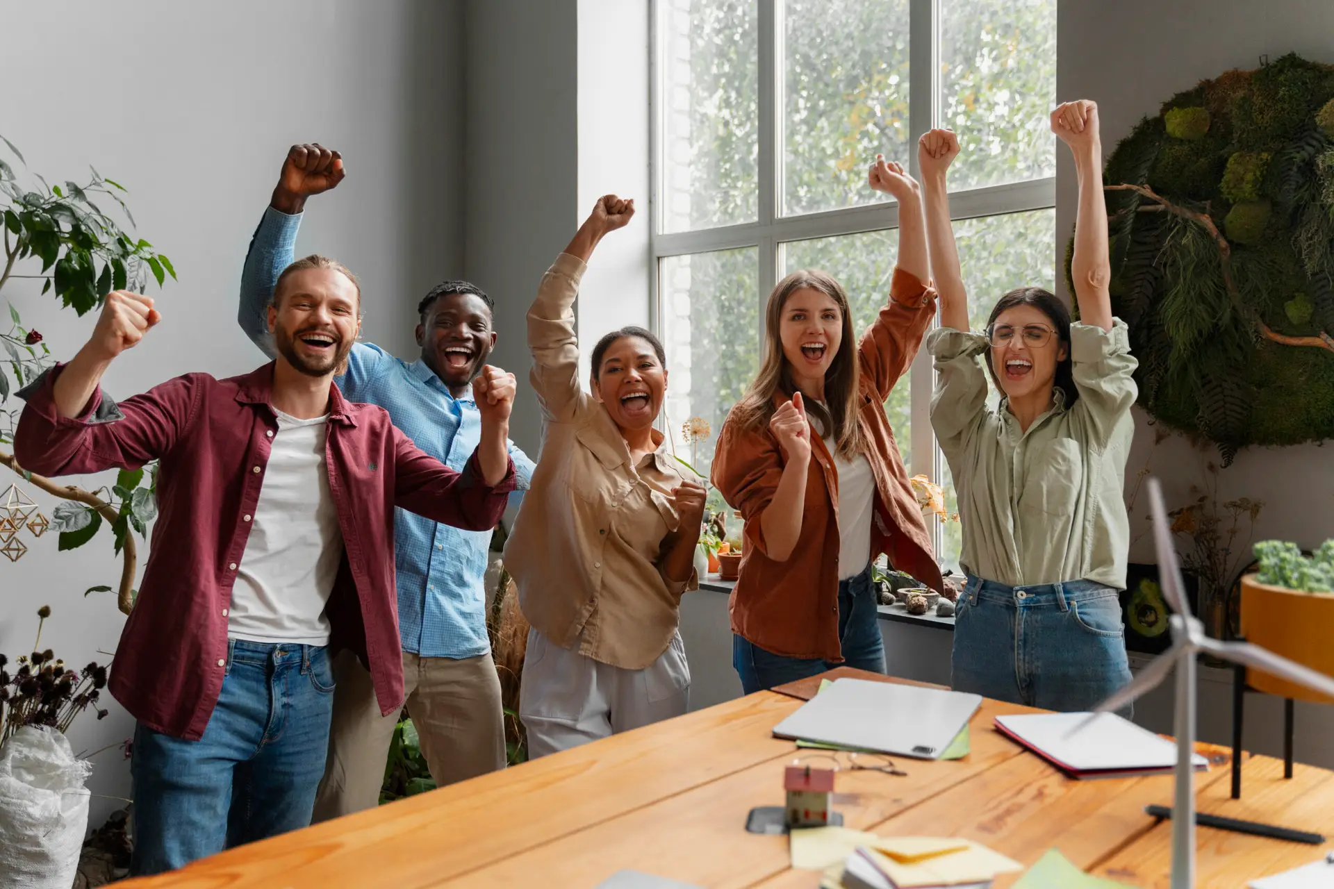 People Raising Hands in Excitement